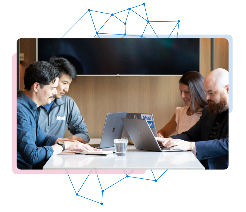 Four people working on computers