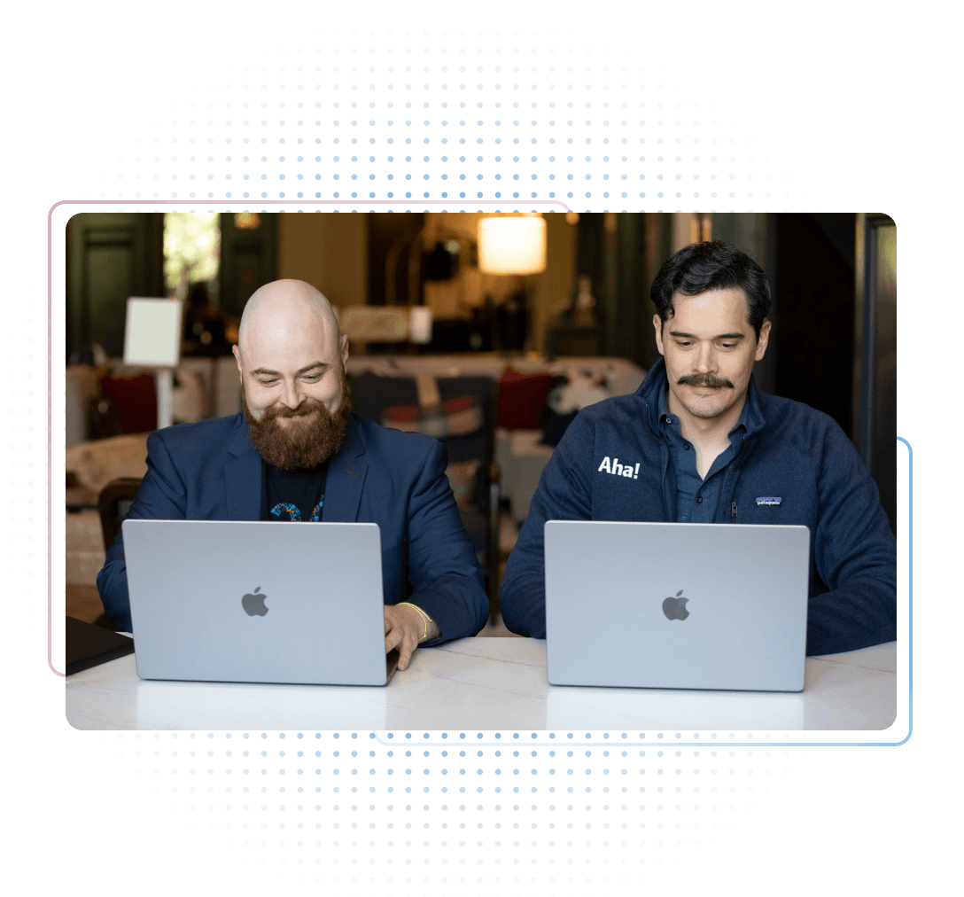 Aha! employees working on laptops